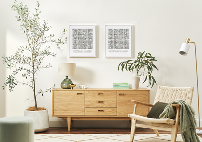 Two Whitstable Squared A3 prints in White Frames on a living room wall